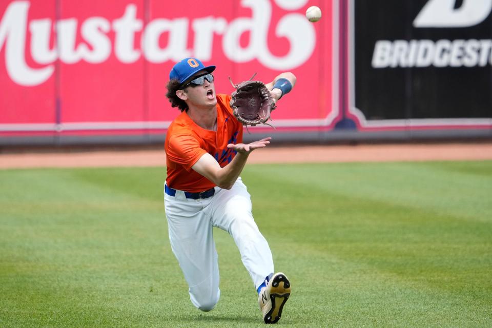 Olentangy Orange's Gabe Miller makes a catch in the outfield during Thursday's Division I state semifinal.