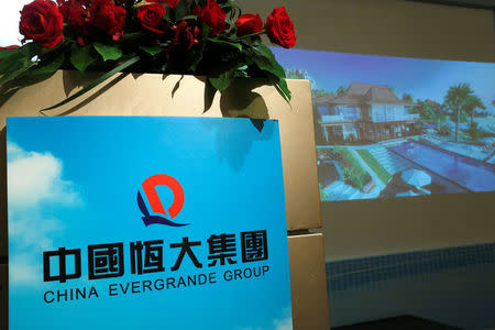 A promotional footage on a property development of China Evergrande Group is shown at a news conference on the company's interim results in Hong Kong, China August 30, 2016. REUTERS/Bobby Yip