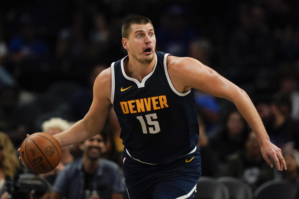 Denver Nuggets center Nikola Jokic looks to pass during the first half of an NBA basketball game against the Los Angeles Clippers, Thursday, Oct. 19, 2023, in Los Angeles. (AP Photo/Ryan Sun)