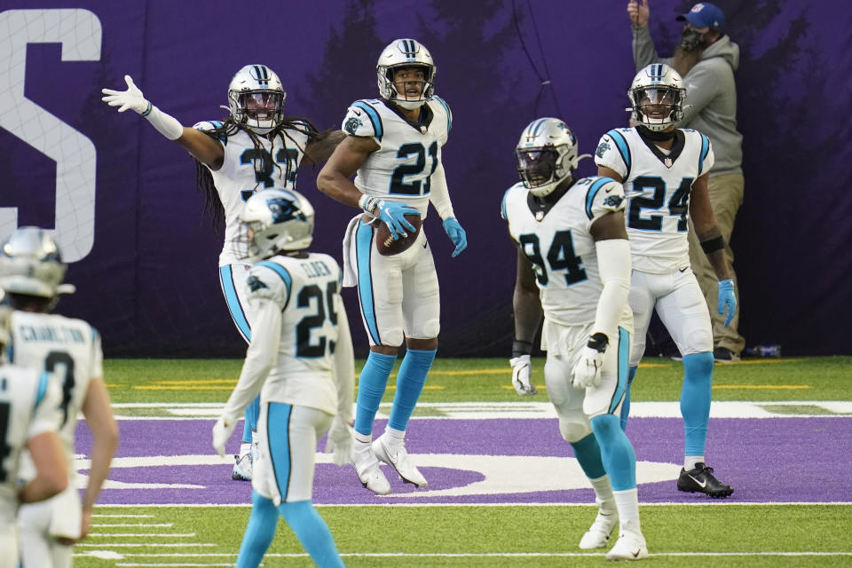 Carolina Panthers safety Jeremy Chinn (21) celebrates with teammates after returning a fumble 17-yards for a touchdown during the second half of an NFL football game against the Minnesota Vikings, Sunday, Nov. 29, 2020, in Minneapolis. (AP Photo/Jim Mone)