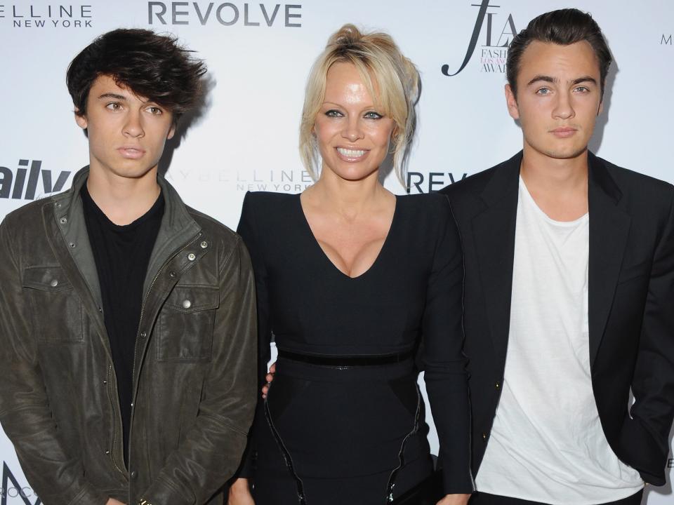 Pamela Anderson, Dylan Lee, and Brandon Lee arrive at the Fashion Los Angeles Awards on March 20, 2016