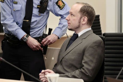 Anders Behring Breivik, who killed 77 people in twin attacks in Norway last year, pictured at his trial in Oslo. Tens of thousands of rose-waving Norwegians gathered in central Oslo to deride Breivik by singing a song he hates, viewing it as Marxist indoctrination