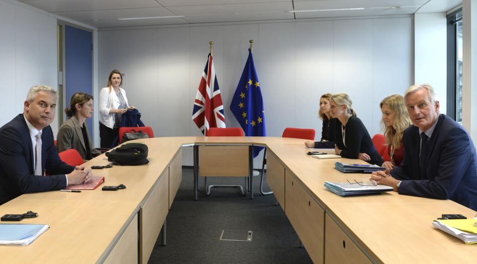 European Union chief Brexit negotiator Michel Barnier, right, meets with Britain's Brexit Secretary Stephen Barclay, left, at EU headquarters in Brussels, Friday, Sept. 27, 2019. Michel Barnier is meeting with Irish Foreign Minister Simon Coveney and UK Brexit secretary Stephen Barclay on Friday, seeking a way to unblock the stalled negotiations on Britain's withdrawal from the bloc. (Johanna Geron, Pool Photo via AP)