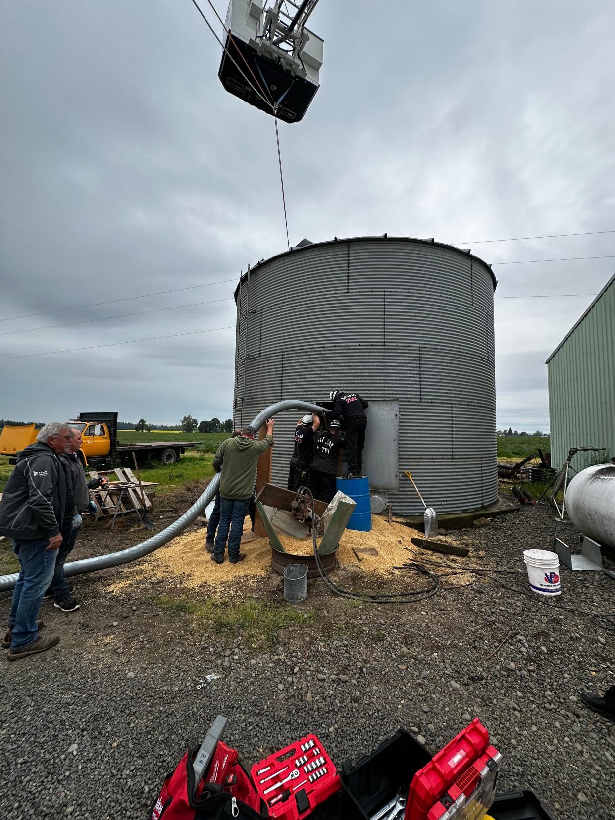 Firefighters were called on Tuesday to extricate a man trapped in a grain silo west of Salem.