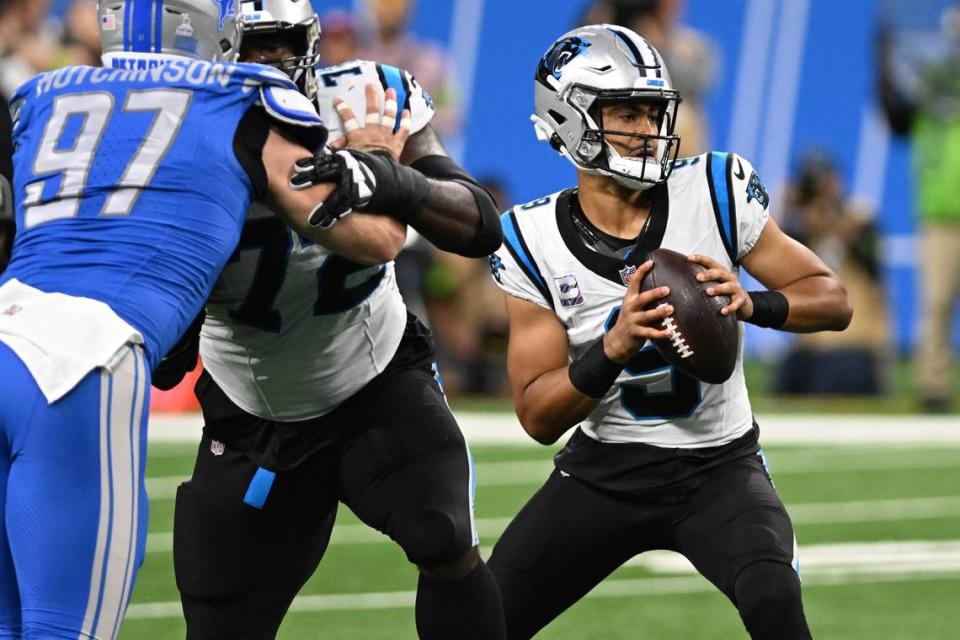 Carolina Panthers quarterback Bryce Young (9) runs out of the pocket against the Detroit Lions in the first quarter at Ford Field on Sunday, Oct. 8, 2023.