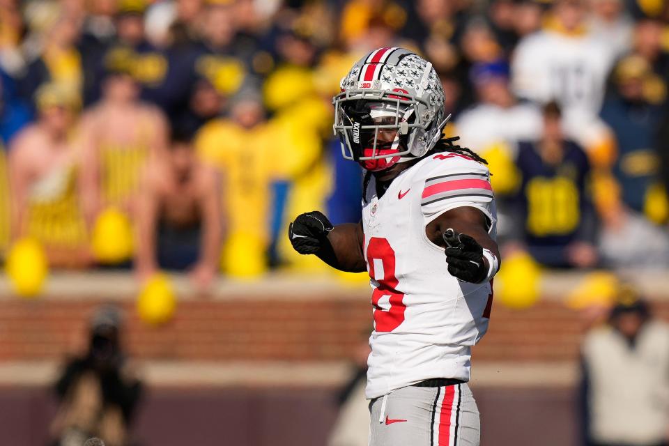 Nov 25, 2023; Ann Arbor, Michigan, USA; Ohio State Buckeyes wide receiver Marvin Harrison Jr. (18) celebrates a catch during the NCAA football game against the Michigan Wolverines at Michigan Stadium. Ohio State lost 30-24.