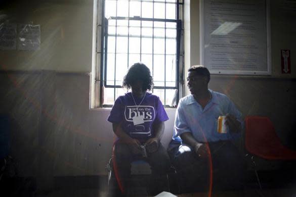 Dejane (L), 14, sits with her father Jonathan at San Quentin state prison in San Quentin, California June 8, 2012.