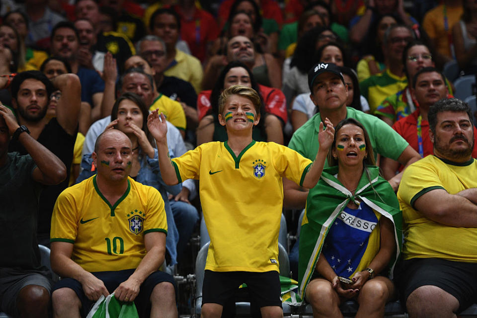 A young fan reacts during the women's indoor volleyball quarterfinal between Brazil and China. (Getty)