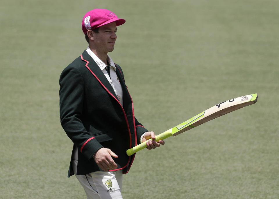 FILE - Australia's captain Tim Paine carries a bat before they train at the Sydney Cricket Ground in Sydney on Jan. 5, 2021, ahead of their cricket test against India. Paine has quit as captain after admitting on Friday, Nov. 19, 2021, he sent explicit messages to a female co-worker. (AP Photo/Rick Rycroft, File)