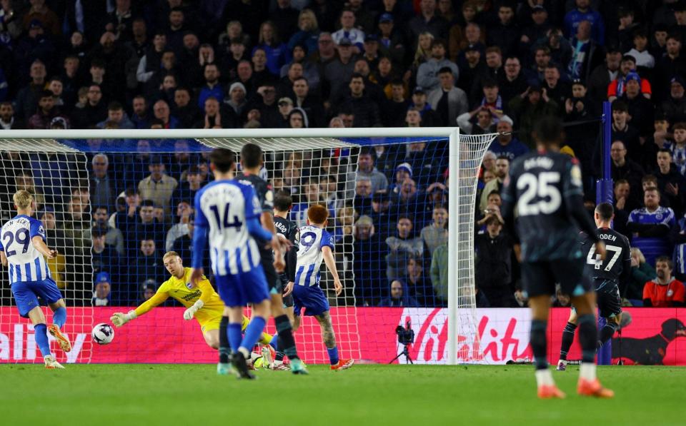 Phil Foden scores their third goal past Brighton & Hove Albion's Jason Steele