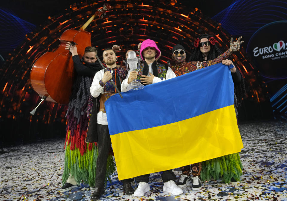 Members of the Kalush Orchestra from Ukraine celebrate after winning the Grand Final of the Eurovision Song Contest at Palaolimpico arena, in Turin, Italy, Saturday, May 14, 2022. (AP Photo/Luca Bruno)