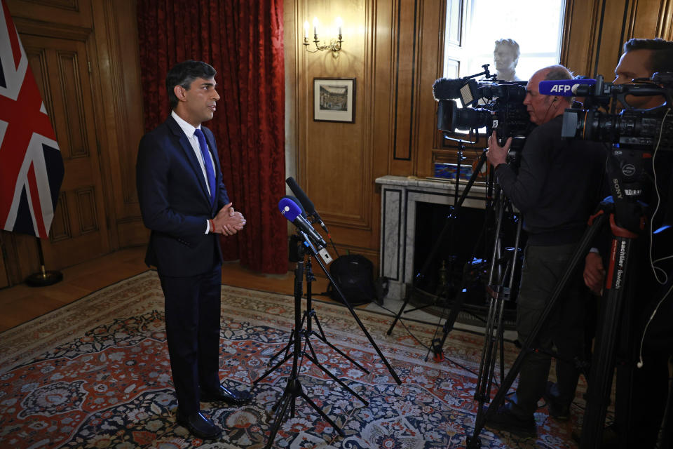 Britain's Prime Minister Rishi Sunak records a statement on the Iranian attacks on Israel overnight, inside 10 Downing Street, London, Sunday, April 14, 2024. Israel praised the success of its defenses in the face of an unprecedented attack by Iran involving hundreds of drones, ballistic missiles and cruise missiles. (Benjamin Cremel/Pool via AP)