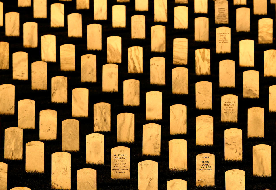 <p>Headstones glow in the late-day sun ahead of Memorial Day at Leavenworth National Cemetery, May 28, 2017, in Leavenworth, Kan. (Photo: Charlie Riedel/AP) </p>