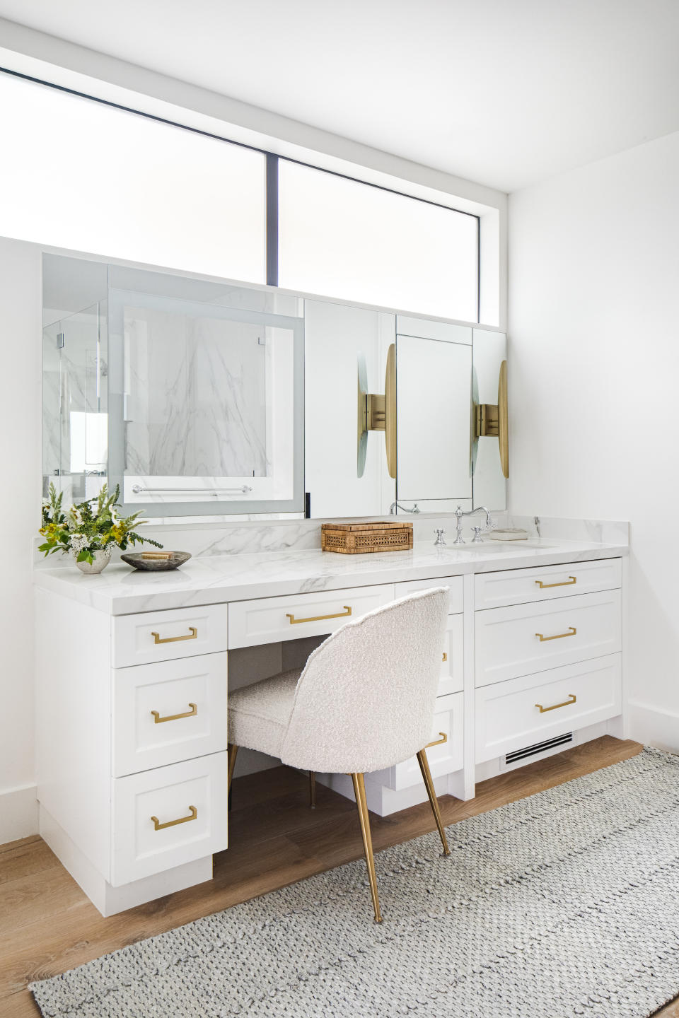 <p> 'When our client asked for the perfect makeup vanity, we knew we needed more than just a sitting area,' says Lindye Galloway, founder, and chief creative officer of Lindye Galloway Studio + Shop. 'This bathroom vanity features a LED mirror that is built into the bigger mirror for perfect makeup application.' </p> <p> 'We also wanted to make a statement with the sink, so we added unique lighting that allows for a warm glow. The vanity itself was given the perfect storage in the drawers for easy bathroom vanity organization.' </p>