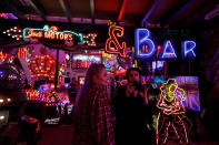 <p>People take pictures of neon signs and artworks in God’s Own Junkyard gallery and cafe in London, Britain, May 13, 2017. (Photo: Russell Boyce/Reuters) </p>