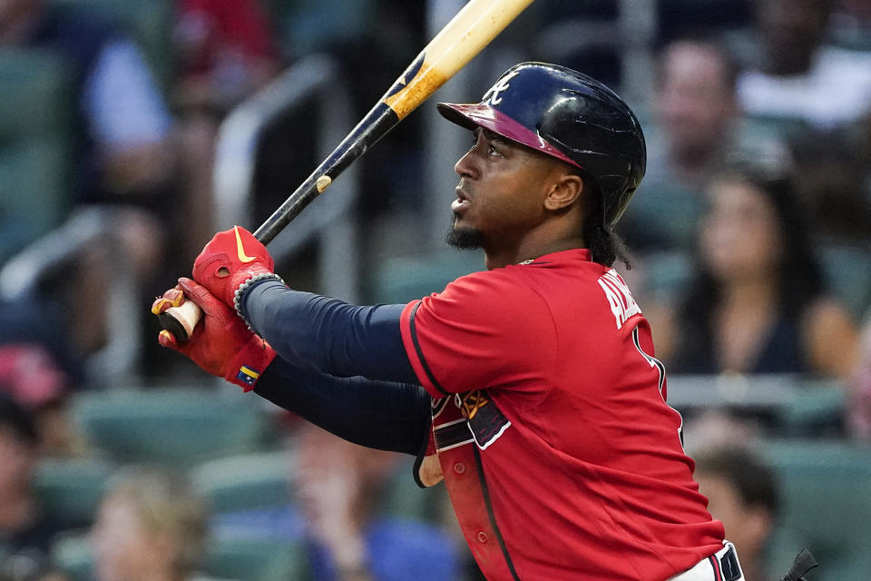 Atlanta Braves' Ozzie Albies watches his RBI double during the fourth inning of the team's baseball game against the Pittsburgh Pirates on Friday, June 10, 2022, in Atlanta. (AP Photo/John Bazemore)