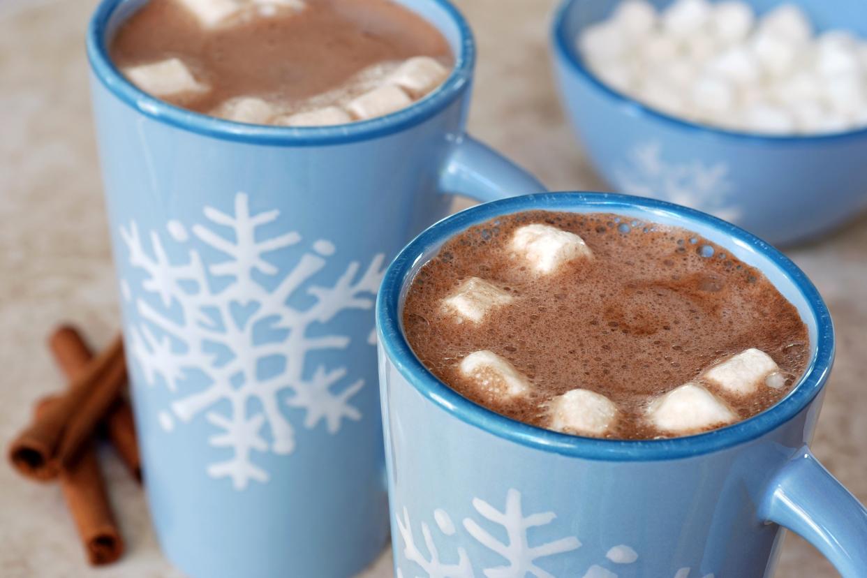 Snowflake mugs with hot chocolate and marshmallows
