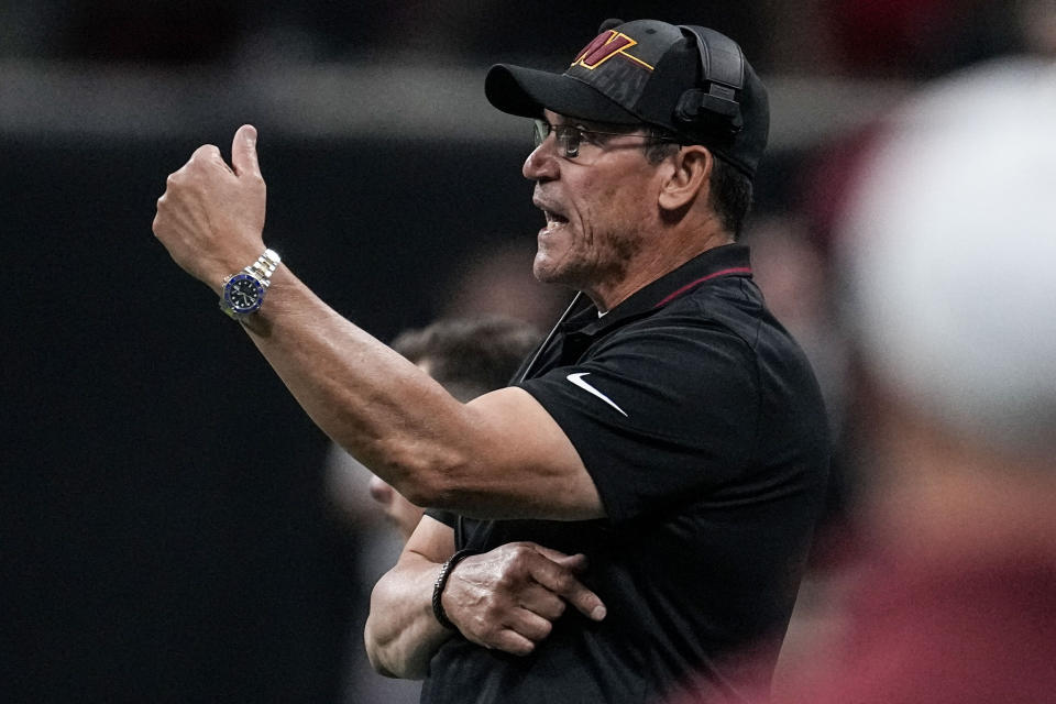 Washington Commanders head coach Ron Rivera speaks during the first half of an NFL football game against the Washington Commanders, Sunday, Oct. 15, 2023, in Atlanta. (AP Photo/John Bazemore)