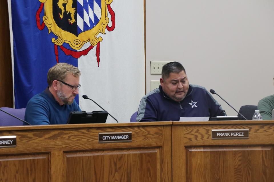 Sturgis City Manager Michael Hughes, left, listens as commissioner Frank Perez discuss his preferences for an executive search firm to find the city's next city manager. Hughes is stepping down in January to pursue other opportunities.