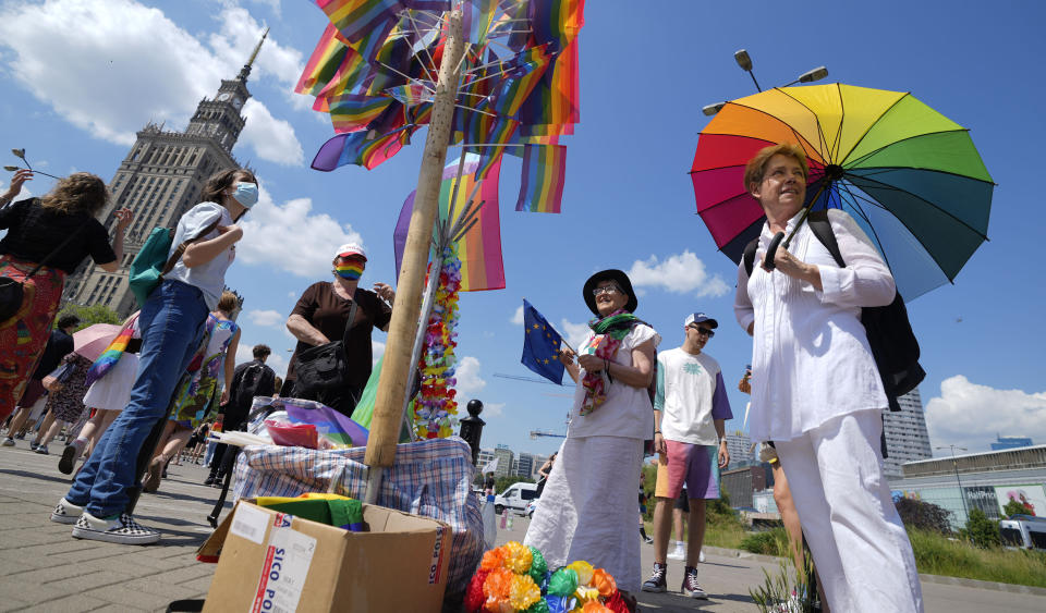 People walk towards the starting point of the Equality Parade, an LGBT pride parade, in Warsaw, Poland, Saturday, June 19, 2021.(AP Photo/Czarek Sokolowski)