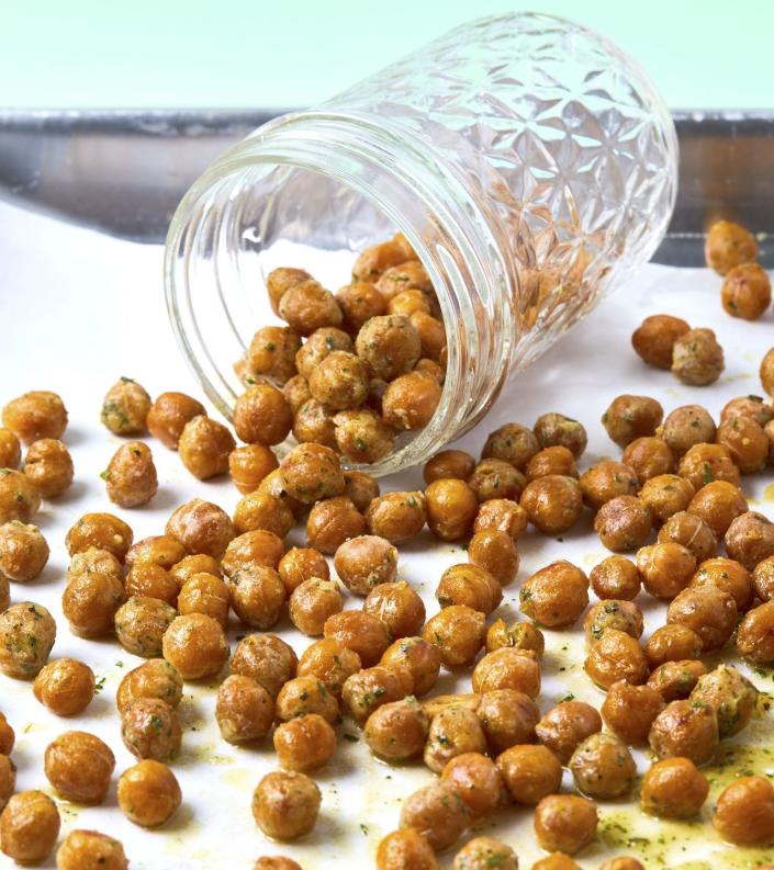 <p><a href="https://www.delish.com/cooking/recipe-ideas/g40692357/chickpea-recipes/" rel="nofollow noopener" target="_blank" data-ylk="slk:Chickpeas" class="link ">Chickpeas</a> get super-crispy in the air fryer and make the perfect, crunchy snack. So much better than snacking on a bag of chips! Make sure your chickpeas are dry before going in, and remember, pull them slightly earlier than you think as they'll crisp as they cool.</p><p>Get the <strong><a href="https://www.delish.com/cooking/recipe-ideas/a27496150/cool-ranch-chickpeas-recipe/" rel="nofollow noopener" target="_blank" data-ylk="slk:Cool Ranch Chickpeas recipe" class="link ">Cool Ranch Chickpeas recipe</a></strong>.</p>