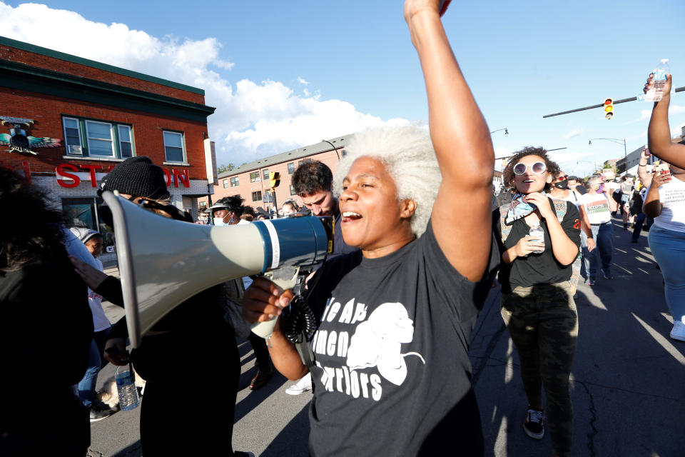 Cariol Horne marches during a protest organized by We Pump 716 and the Liberation Collective, Friday, Sept. 4, 2020, in Buffalo. Horne, a Buffalo police officer who was fired for trying to stop another officer from using a chokehold on a handcuffed suspect, has won a years-long legal fight to collect her pension on Tuesday, April 13, 2021. A state Supreme Court judge cited the changing landscape around the use of force by police and a recently passed "duty to intervene" statute adopted by the city. (Sharon Cantillon/The Buffalo News via AP)