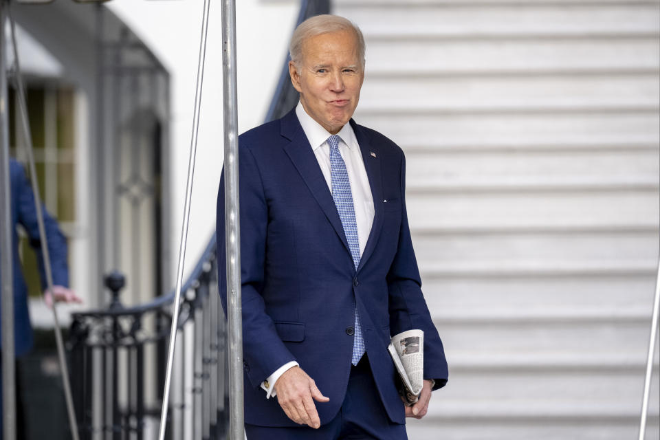 President Joe Biden walks towards members of the media before boarding Marine One on the South Lawn of the White House in Washington, Friday, Feb. 24, 2023, for travel to Wilmington, Del. (AP Photo/Andrew Harnik)