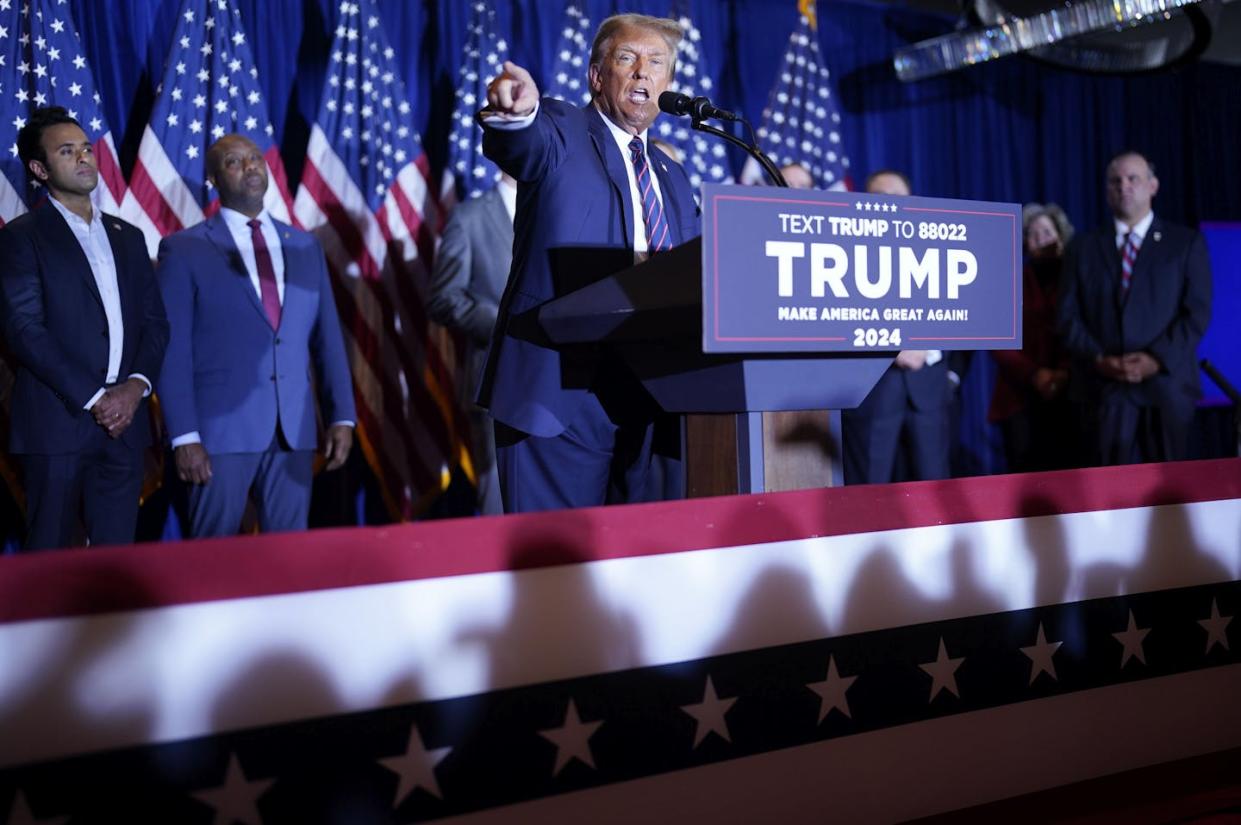 Former president Donald Trump speaks as potential vice presidential hopefuls Vivek Ramaswamy and Sen. Tim Scott look on. <a href="https://www.gettyimages.com/detail/news-photo/former-president-donald-trump-speaks-after-he-was-projected-news-photo/1948411111?adppopup=true" rel="nofollow noopener" target="_blank" data-ylk="slk:Jabin Botsford/The Washington Post via Getty Images;elm:context_link;itc:0;sec:content-canvas" class="link ">Jabin Botsford/The Washington Post via Getty Images </a>