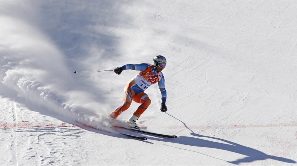 Norway's Aksel Lund Svindal comes to a halt at the end of a men's downhill training run for the Sochi 2014 Winter Olympics, Saturday, Feb. 8, 2014, in Krasnaya Polyana, Russia. (AP Photo/Christophe Ena)