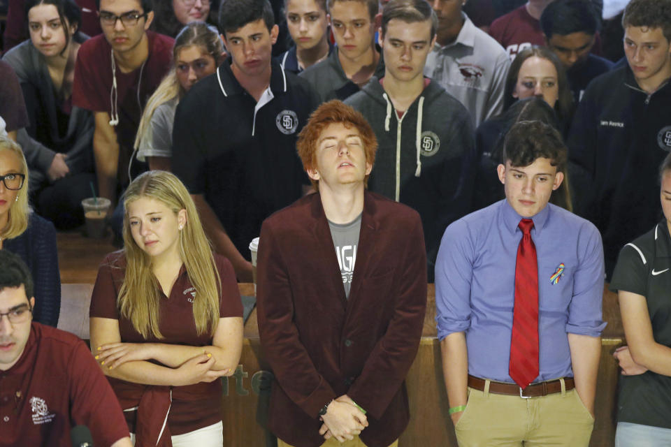 <p>Jaclyn Corin, Ryan Deitsch and Alfonso Calderon along with their classmates from Marjory Stoneman Douglas High School listen as fellow student Lorenzo Prado speaks at a news conference recalling the day of the shooting, in Tallahassee, Fla., Wednesday, Feb. 21, 2018. (Photo: Susan Stocker/South Florida Sun-Sentinel via AP) </p>