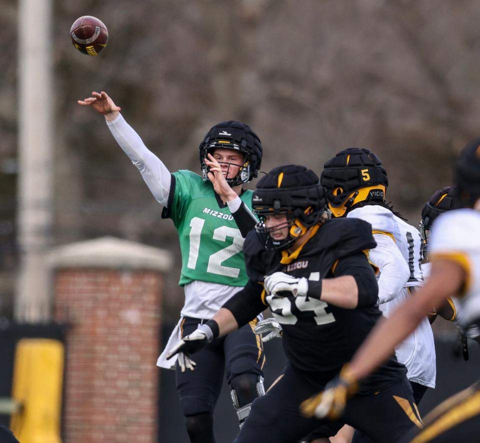 Missouri's Brady Cook throws a pass during spring football practice.
