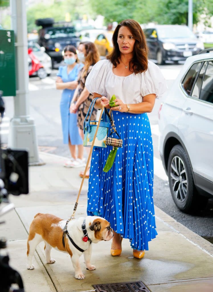 <p>Seen filming a walking-a-dog segment on the streets of New York City, Davis did so carrying the<a href="https://riannaandnina.com/collections/treasure-box/products/the-treasure-box-2" rel="nofollow noopener" target="_blank" data-ylk="slk:Rianna and Nina treasure box bag;elm:context_link;itc:0;sec:content-canvas" class="link "> Rianna and Nina treasure box bag</a>, which was handcrafted in Milan and costs €5,210 (£4,437) to buy. </p><p>According to must-follow Instagram page, @everyoutfitonsatc Charlotte's white blouse is Stella McCartney and polka dot blue asymmetric skirt is Balenciaga - which is still available to buy:</p><p><a class="link " href="https://www.net-a-porter.com/en-gb/shop/product/balenciaga/belted-asymmetric-pleated-polka-dot-crepe-midi-skirt/1238359" rel="nofollow noopener" target="_blank" data-ylk="slk:SHOP NOW;elm:context_link;itc:0;sec:content-canvas">SHOP NOW</a> Belted asymmetric pleated polka-dot crepe midi skirt, £990<br></p><p>NB: Seemingly now the owner of a bulldog rather than Elizabeth Taylor the spaniel, Charlotte was also seen carrying a Burberry poo bag dispense.</p>