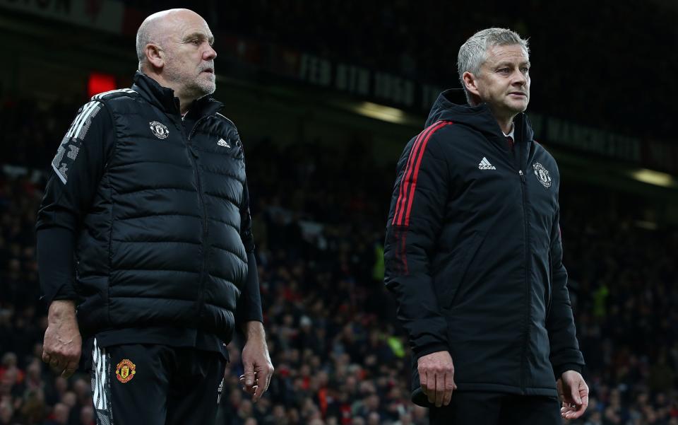 Manager Ole Gunnar Solskjaer and Assistant manager Mike Phelan of Manchester United walk out for the second half during the UEFA Champions League group F match between Manchester United and Atalanta at Old Trafford on October 20, 2021 in Manchester, England. - GETTY IMAGES