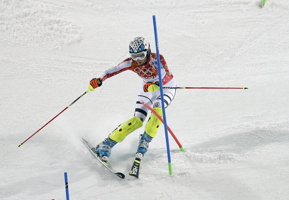 Germany's Maria Hoefl-Riesch passes a gate during the second run of the women's slalom at the Sochi 2014 Winter Olympics, Friday, Feb. 21, 2014, in Krasnaya Polyana, Russia. (AP Photo/Christophe Ena)