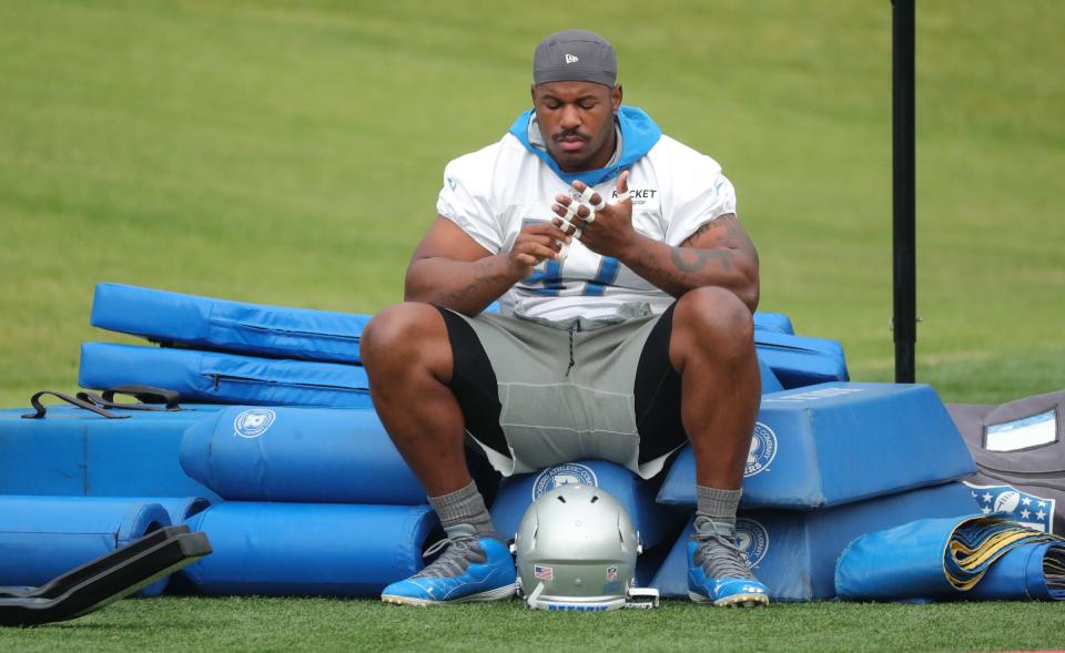 Lions defensive end Nick Williams tapes his hands during training camp in Allen Park on Thursday, July 29, 2021.