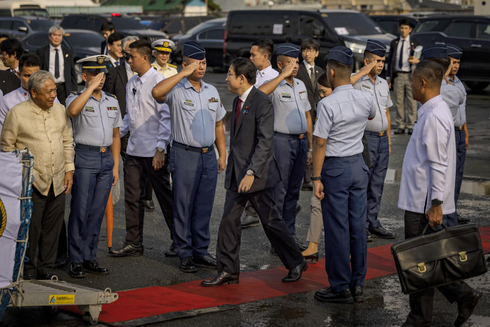 Japan's Prime Minister Fumio Kishida, center, visits the BRP Teresa Magbanua ship at the Philippine Coast Guard headquarters on Saturday Nov. 4, 2023 in Manila, Philippines. (Ezra Acayan/Pool Photo via AP)