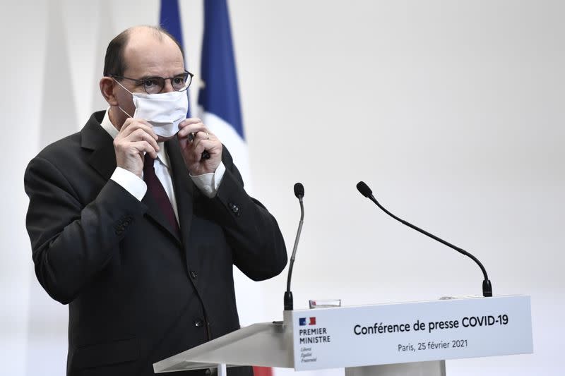 French Prime Minister Jean Castex touches his protective face mask during a press conference on the government's current strategy for the ongoing coronavirus disease (COVID-19) pandemic