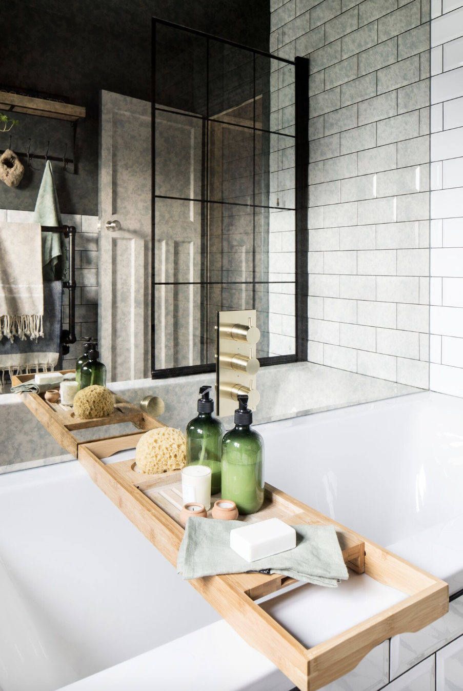 bathroom storage ideas, bath tray over the white tub with products on top