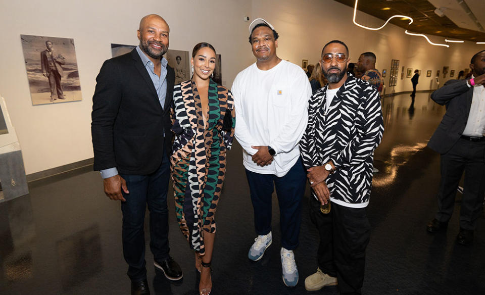 Former Lakers star Derek Fisher and his wife Gloria Govan pose with Residency Gallery’s Rick Garzon and The Kinsey Collection’s Khalil Kinsey at the Kinsey African American Art & History Collection opening night at SoFi Stadium on Aug. 25, 2022.