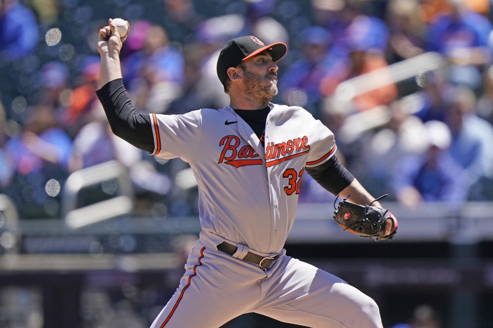 Baltimore Orioles starting pitcher Matt Harvey (32) winds up during the first inning of a baseball game against the New York Mets, Wednesday, May 12, 2021, in New York. (AP Photo/Kathy Willens)