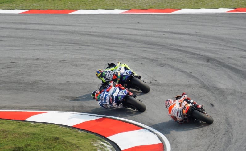 Valentino Rossi leading Jorge Lorenzo and Marc Marquez during the Moto GP race at Sepang in Malaysia. Shot with the 18-200mm F3.5-6.3 lens. Focal length 200mm, exposure 1/1250 sec; f/6.3; ISO 125, Shutter Priority mode.