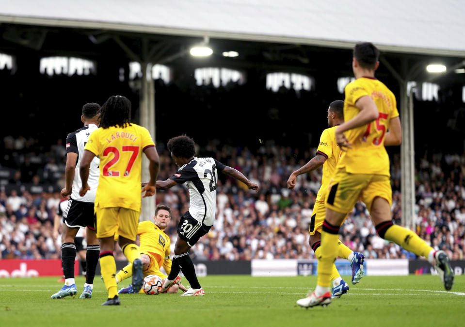 Fulham's Willian scores his side's third goal of the game, during the English Premier League soccer match between Fulham and Sheffield United, at Craven Cottage, London, Saturday, Oct. 7, 2023. ( John Walton/PA via AP)
