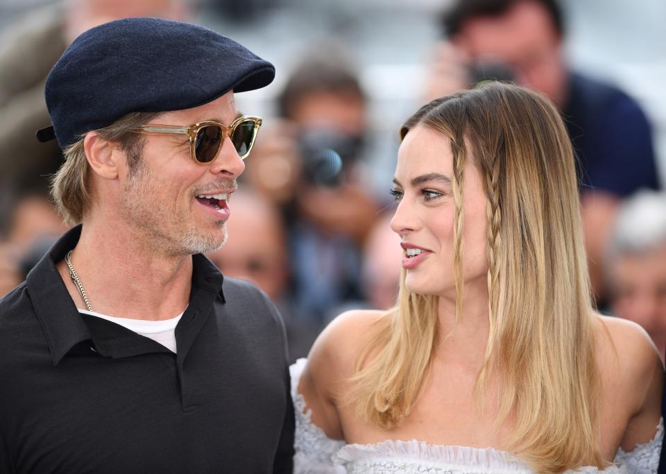 CANNES, FRANCE - MAY 22: US actor Brad Pitt (L) and Australian actress Margot Robbie (R) pose during the photocall for the film 'Once Upon A Time... In Hollywood' in competition at the 72nd annual Cannes Film Festival in Cannes, France on May 22, 2019. (Photo by Mustafa Yalcin/Anadolu Agency/Getty Images)