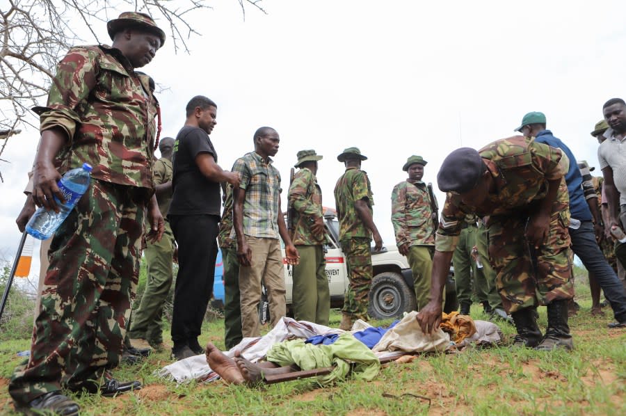 FILE – An exhumed body of a victim of a religious cult is laid out in the village of Shakahola, near the coastal city of Malindi, in southern Kenya Sunday, April 23, 2023. Kenya’s top prosecutor on Tuesday ordered that 95 people from a doomsday cult be charged with murder, cruelty, child torture and other crimes in the deaths of 429 people believed to be members of the church. (AP Photo, File)