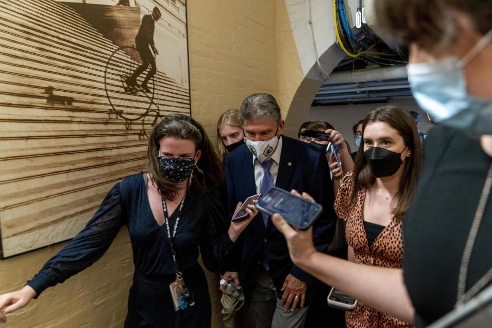 Sen. Joe Manchin, D-W.Va., speaks to reporters as he leaves a private meeting with Sen. Kyrsten Sinema, D-Ariz., White House domestic policy adviser Susan Rice, Director of the National Economic Council Brian Deese, and other White House officials on Capitol Hill in Washington, Thursday, Sept. 30, 2021. Determined not to let his $3.5 trillion government overhaul collapse, President Joe Biden cleared his schedule late Thursday and Speaker Nancy Pelosi pushed the House into an evening session as the Democratic leaders worked to negotiate a scaled-back plan centrist holdouts would accept. (AP Photo/Andrew Harnik)