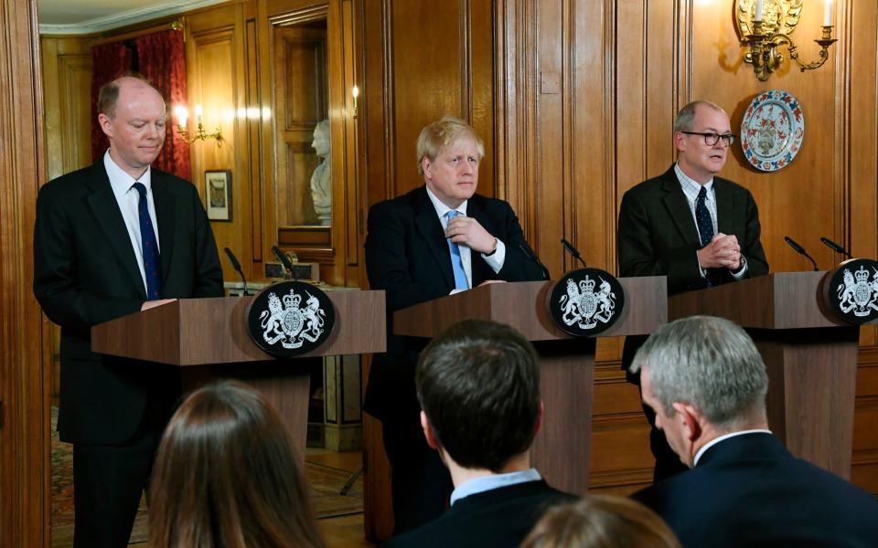 Sir Chris Witty, left, Boris Johnson and Sir Patrick Vallance, right, during a Covid briefing in 2020