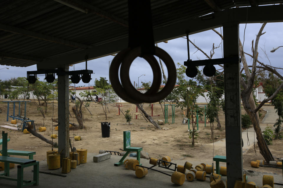 Weights made from cement lie scattered on the ground at an outdoor gym once used by prisoners at the now closed Morelos detention center during a media tour of the former Islas Marias penal colony located off Mexico's Pacific coast, Saturday, March 16, 2019. While one of the most charming of the prison's features, that families, including children, could come live with inmates, some people questioned whether the kids were getting a decent childhood on the island and questioned the cost of providing schooling and recreational facilities. (AP Photo/Rebecca Blackwell)