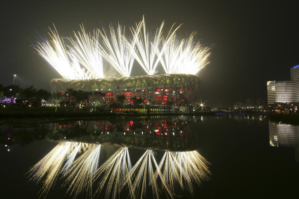 FILE - Fireworks explode during the opening ceremony in the National Stadium at the Beijing 2008 Olympics in Beijing on Aug. 8, 2008. How did Beijing land the Winter Olympics, so soon after it was host to the Summer Olympics in 2008? It becomes the first city in Olympic history to host both Winter and Summer Games. (AP Photo/Bullit Marquez, File)