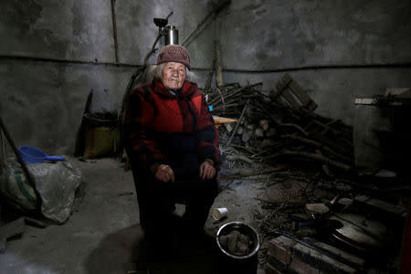 Surviving villager Liu Guizhen, 95, sits in her old house, damaged in the 2008 Sichuan earthquake, at a village on a mountain in Beichuan county, Sichuan province, China, April 6, 2018. REUTERS/Jason Lee