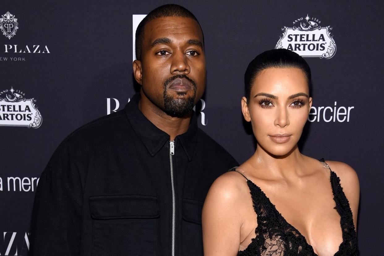 Design for life: Kanye West, with wife Kim Kardashian, is one of 62 nominees in six categories: Dimitrios Kambouris/Getty